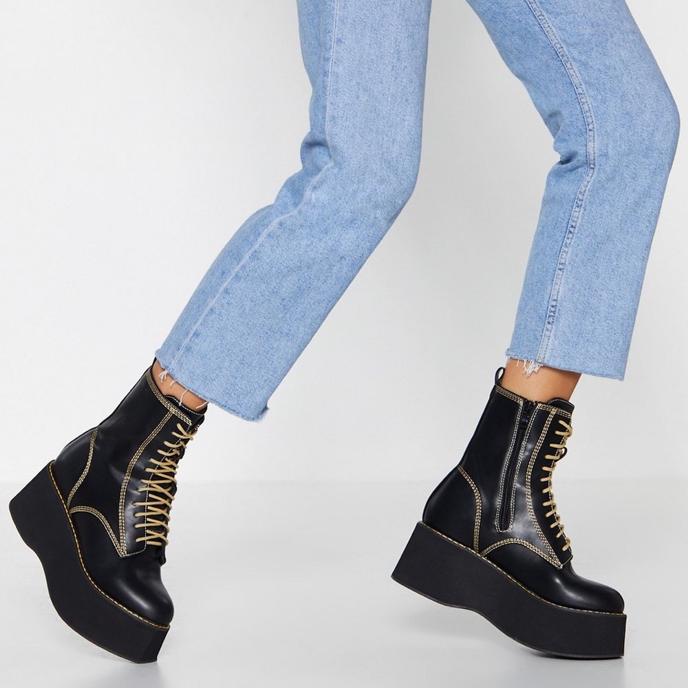 Platform boots with yellow stitching